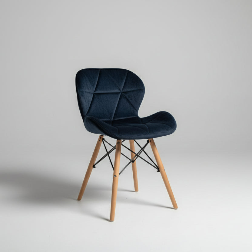 Blue chair with wooden legs on a tiled floor
